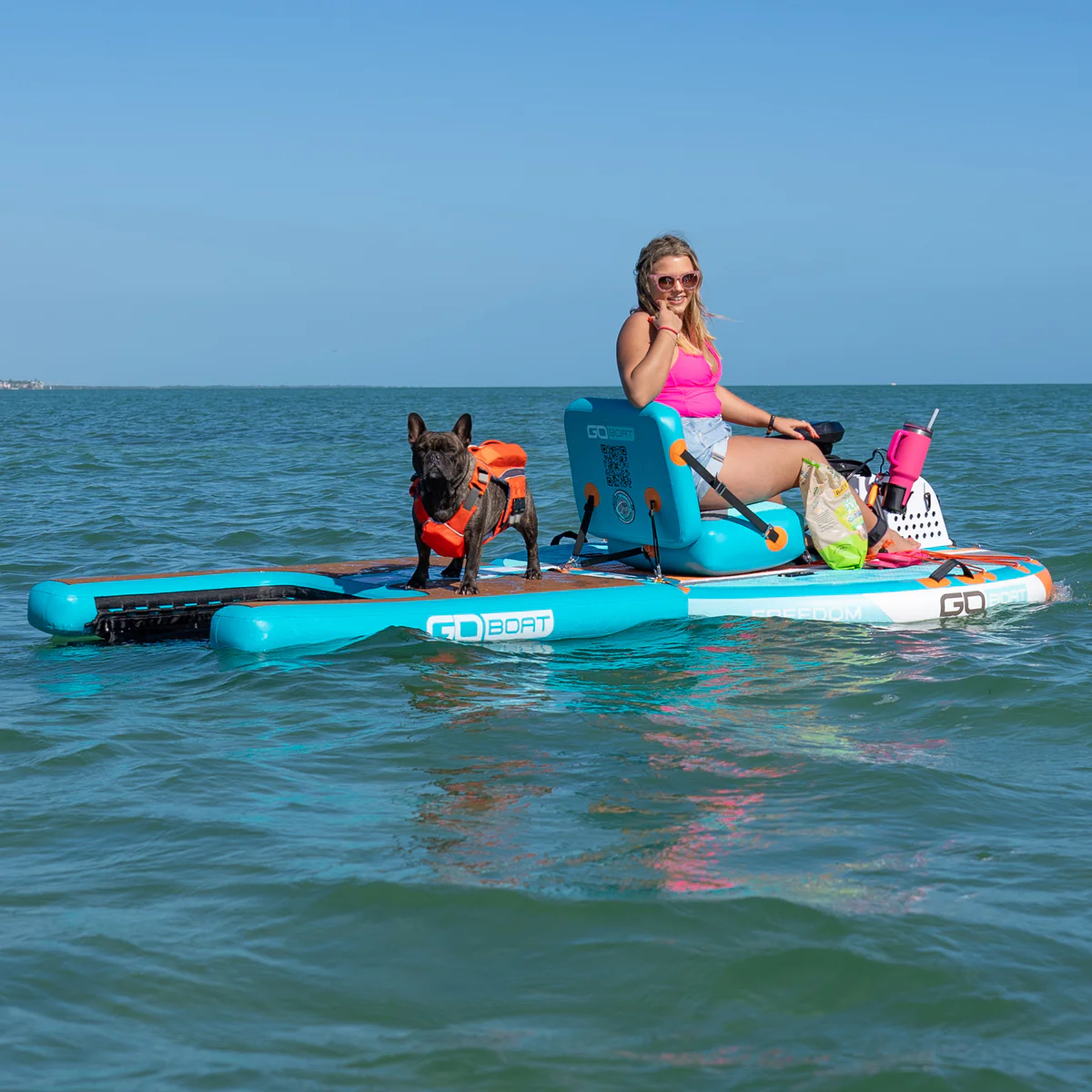 GoBoat with towable doggie dock on the water